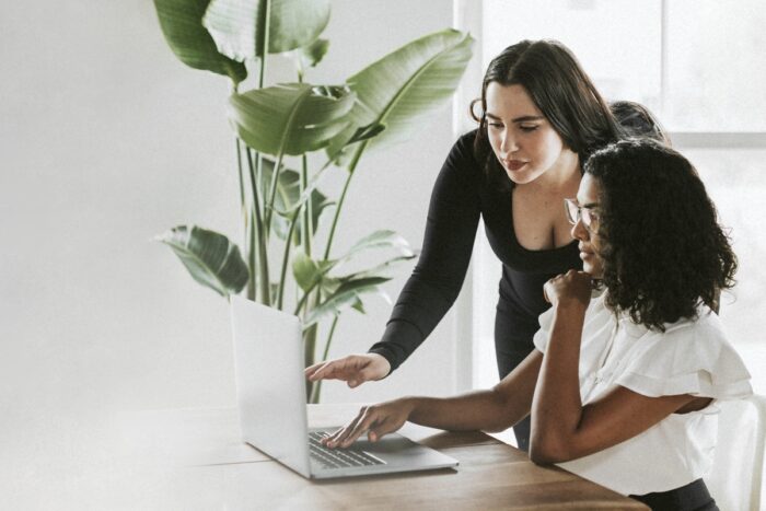 Ace Your Art Website's Product Page Design: A woman looking at a laptop