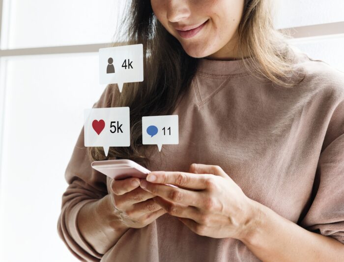 Woman using a smartphone to check social media 