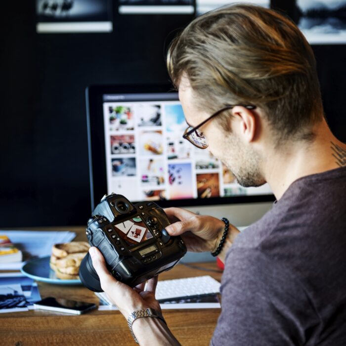 Photographer choosing images for social media 