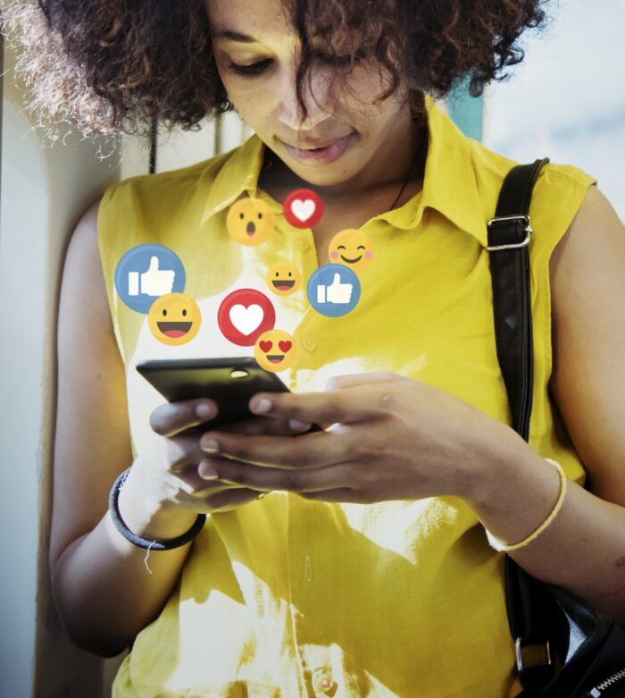 A lady growing her social media presence on her cellphone