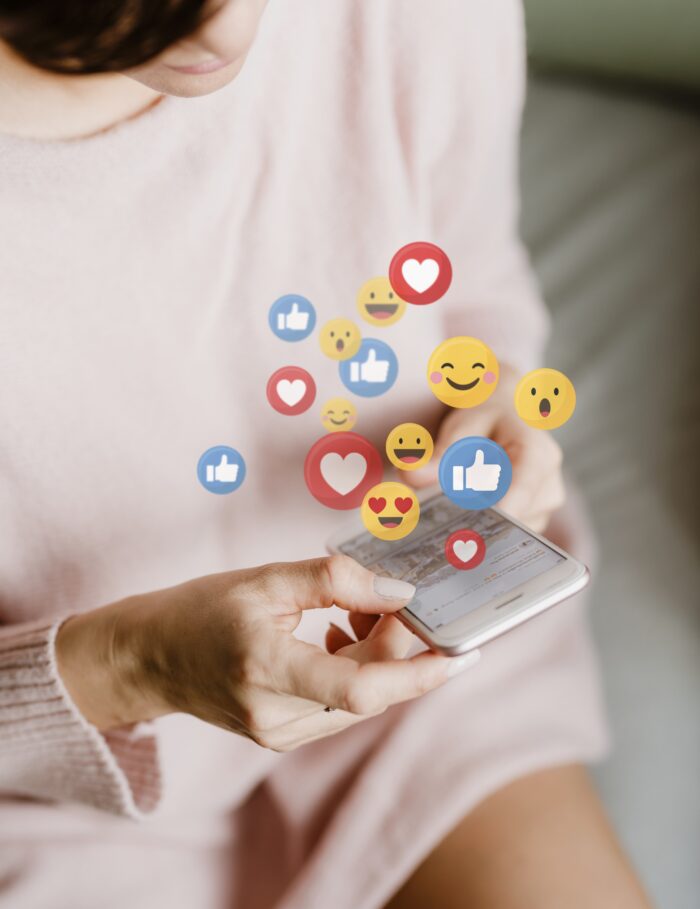 A woman looking at social media on her cellphone 