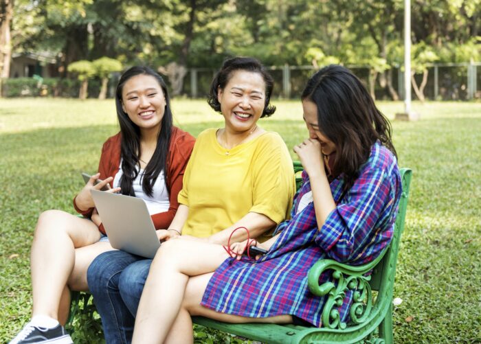 A family looking at social media on their laptop