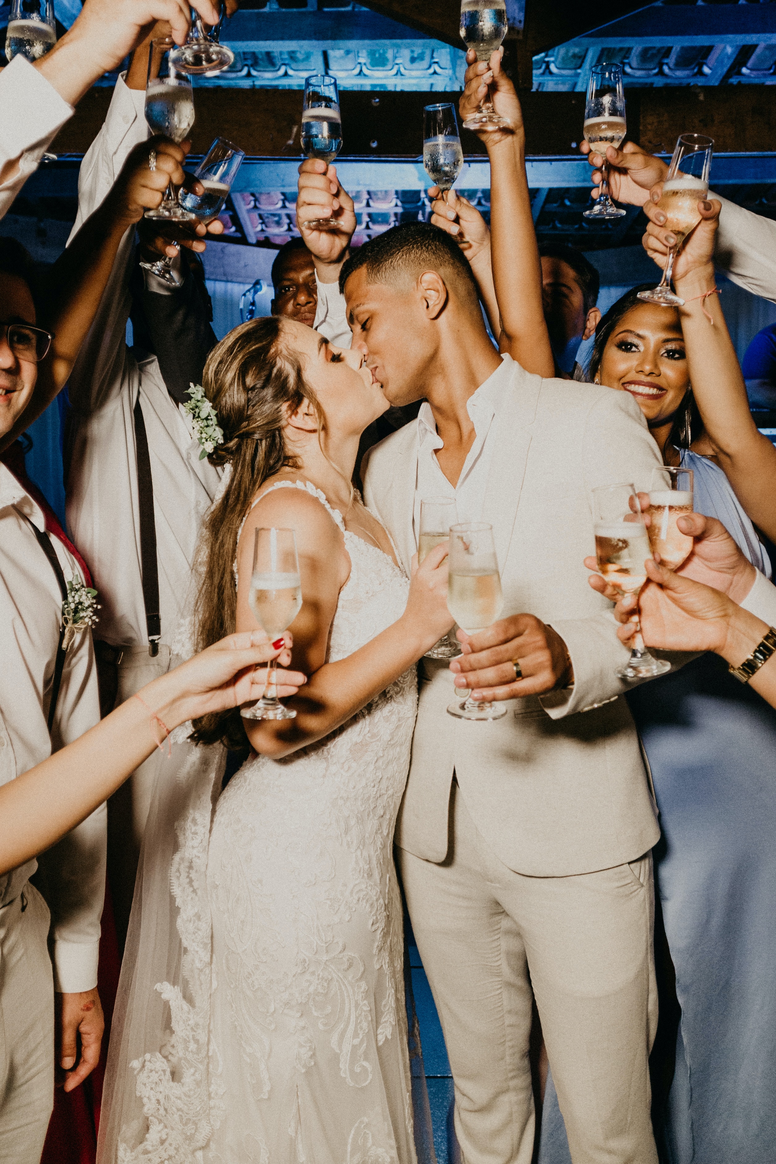 The Ultimate Wedding Photography & Display Guide: A photo of a newly wed couple with glasses of champagne. 