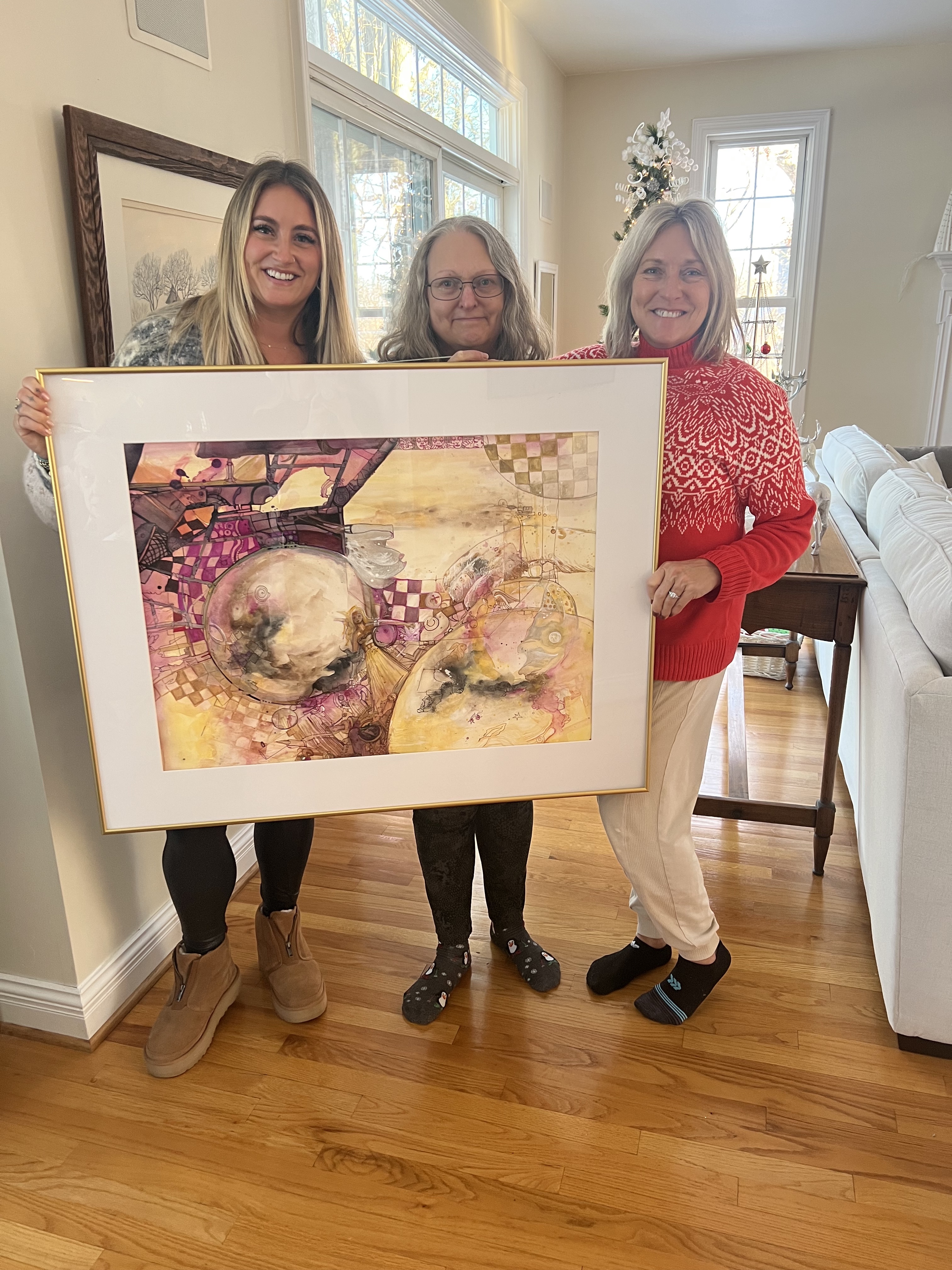 Big Wall Art: Family holding framed oversized art 