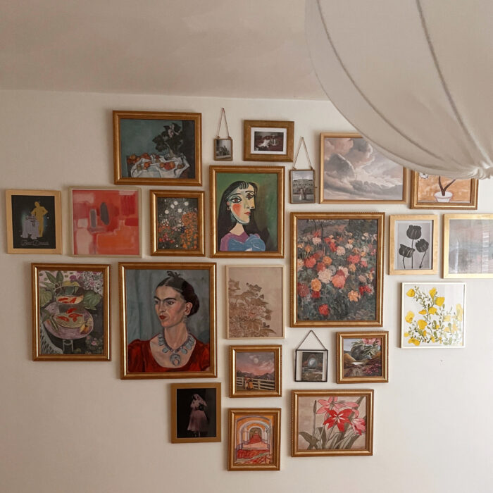 How To Create a Staggered Gallery Wall: A gallery wall with framed paintings