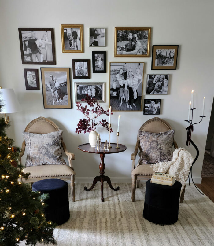 Decor Dilemma: Should Picture Frames Match The Art Or Room? - A living room with gallery wall styled for the holidays