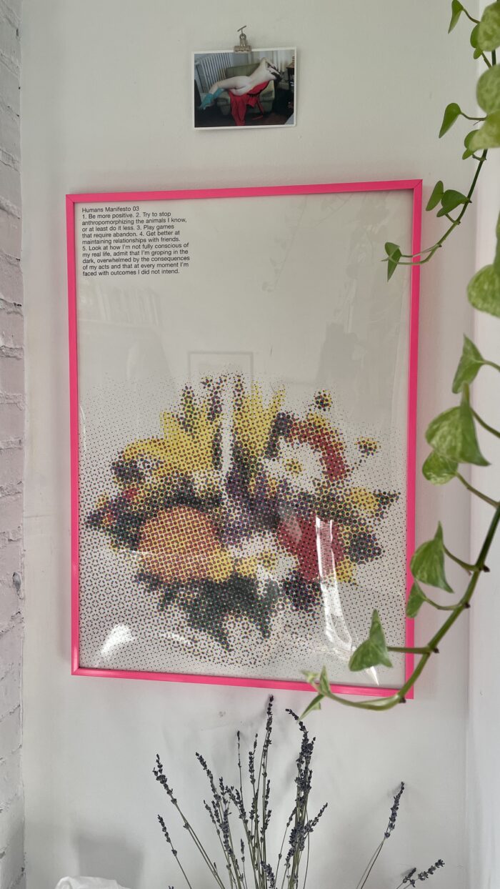 Decor Dilemma: An art print framed with hanging plants.