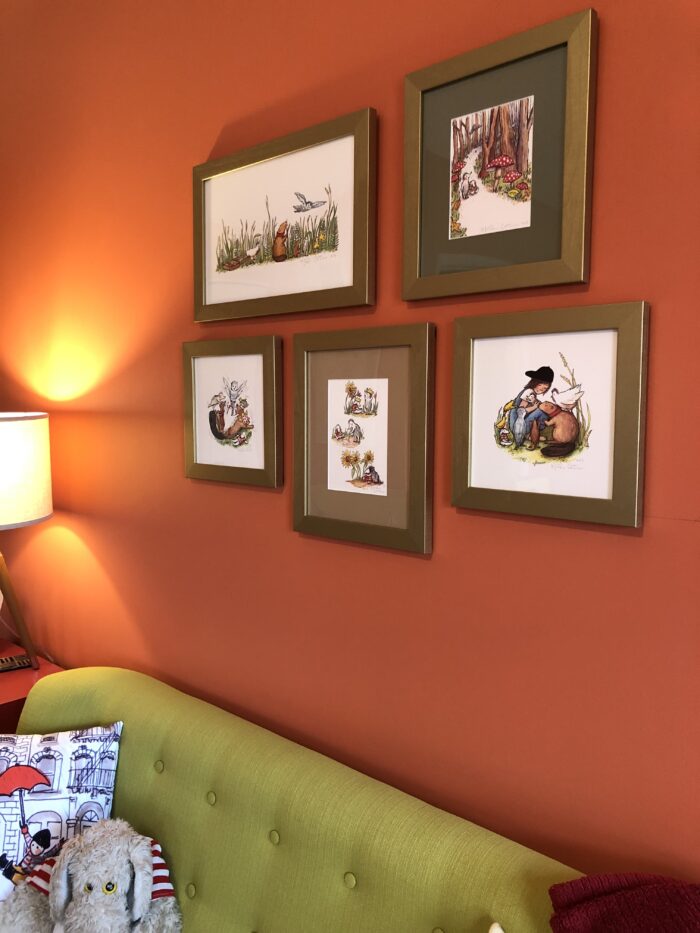 Why Is Framing So Expensive? - A living room with art prints framed