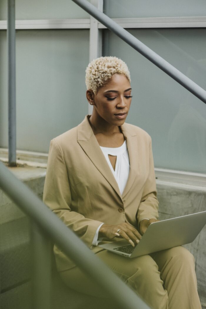 Ecommerce SEO Tips: A lady using a computer outdoors