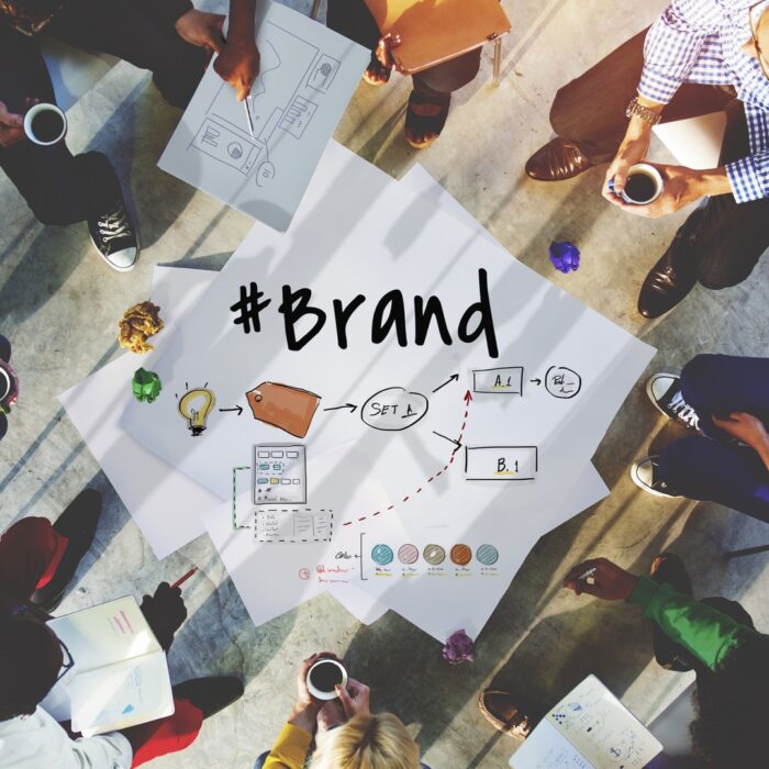 How To Build A Brand: A group of business people discussing branding