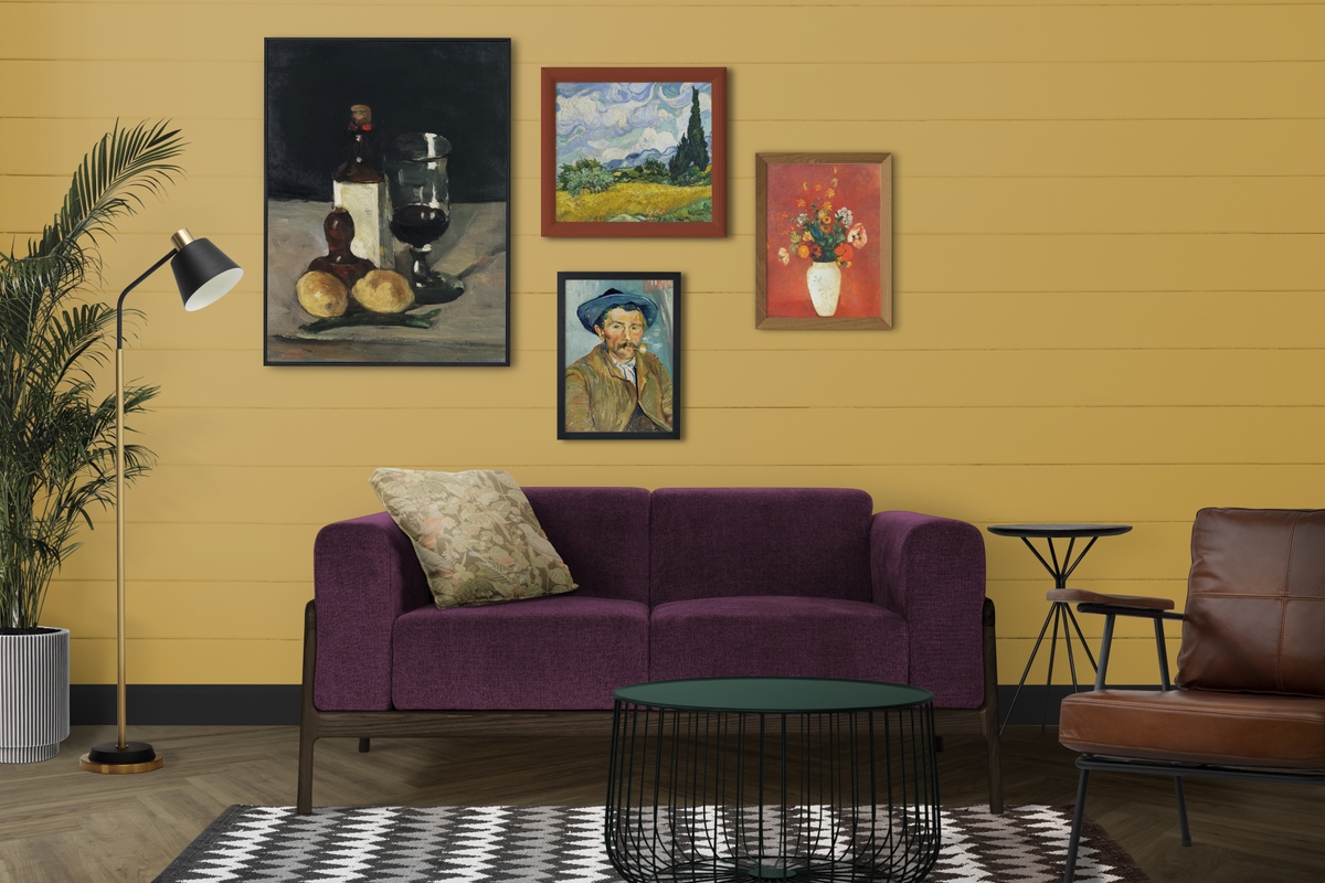 Eclectic decor featuring a purple couch and a gallery wall