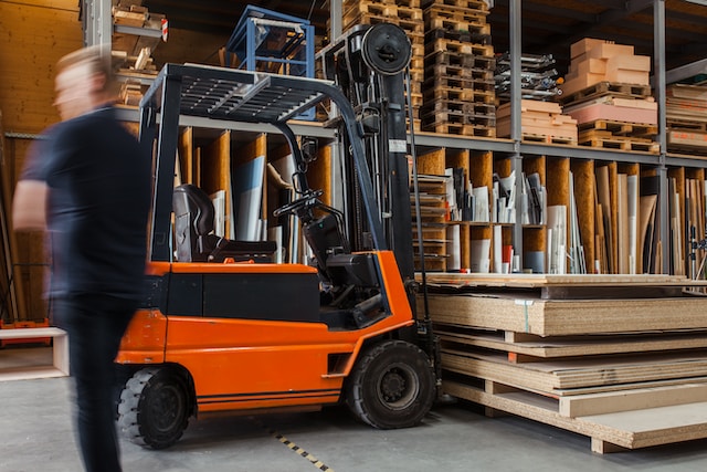 Why Is Framing So Expensive? - A forklift in a warehouse