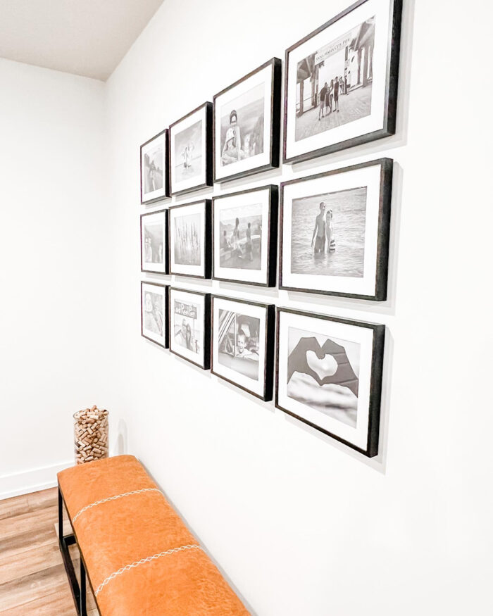 A 3x4 grid wall gallery in a hallway