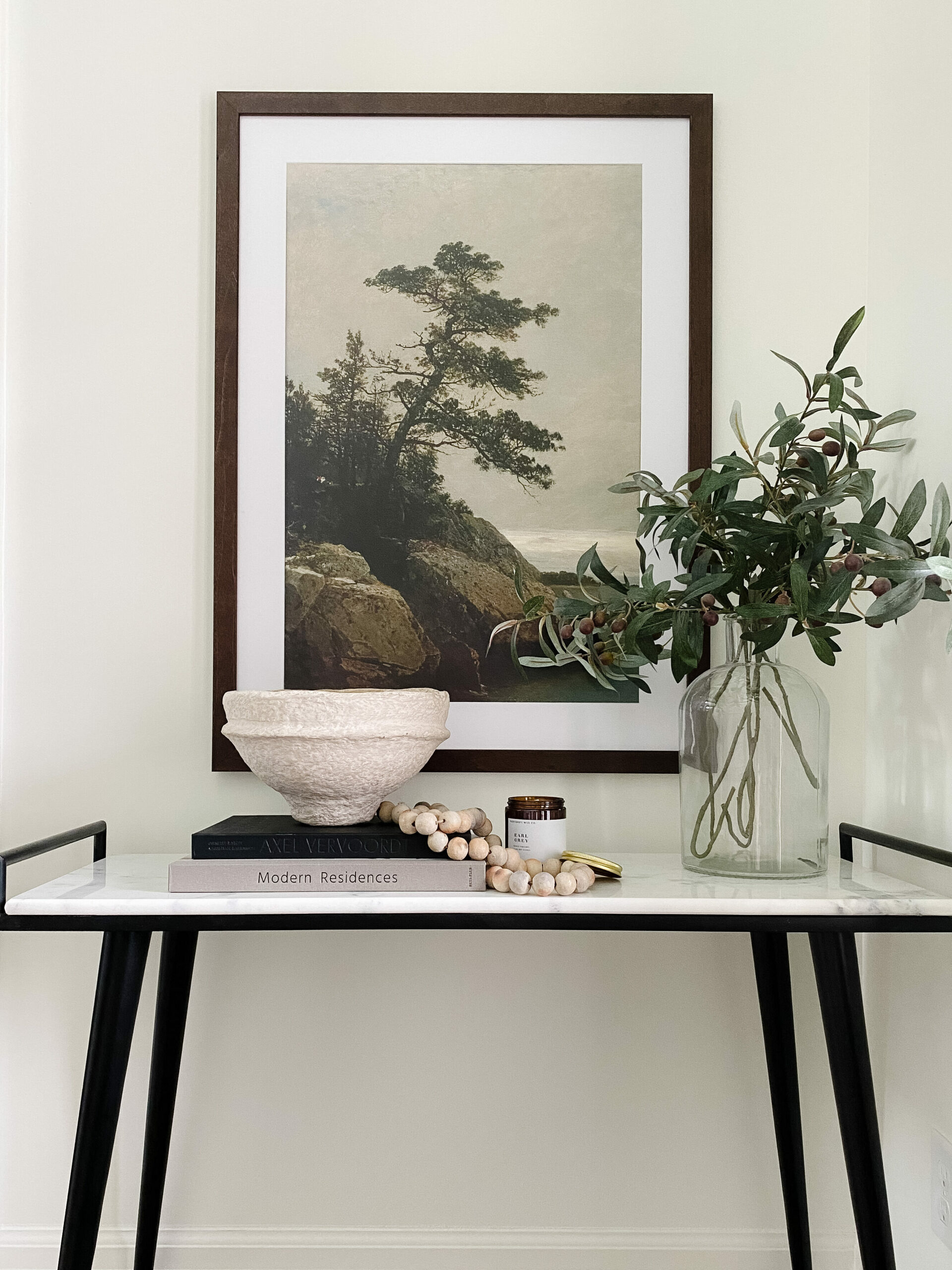 Picture Frame Ideas: a large frame displayed over a modern style desk