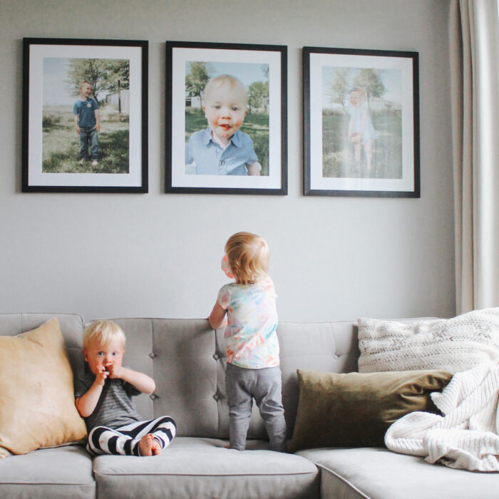 The Perfect Baby Picture Frames: two toddlers check out the baby photo wall art