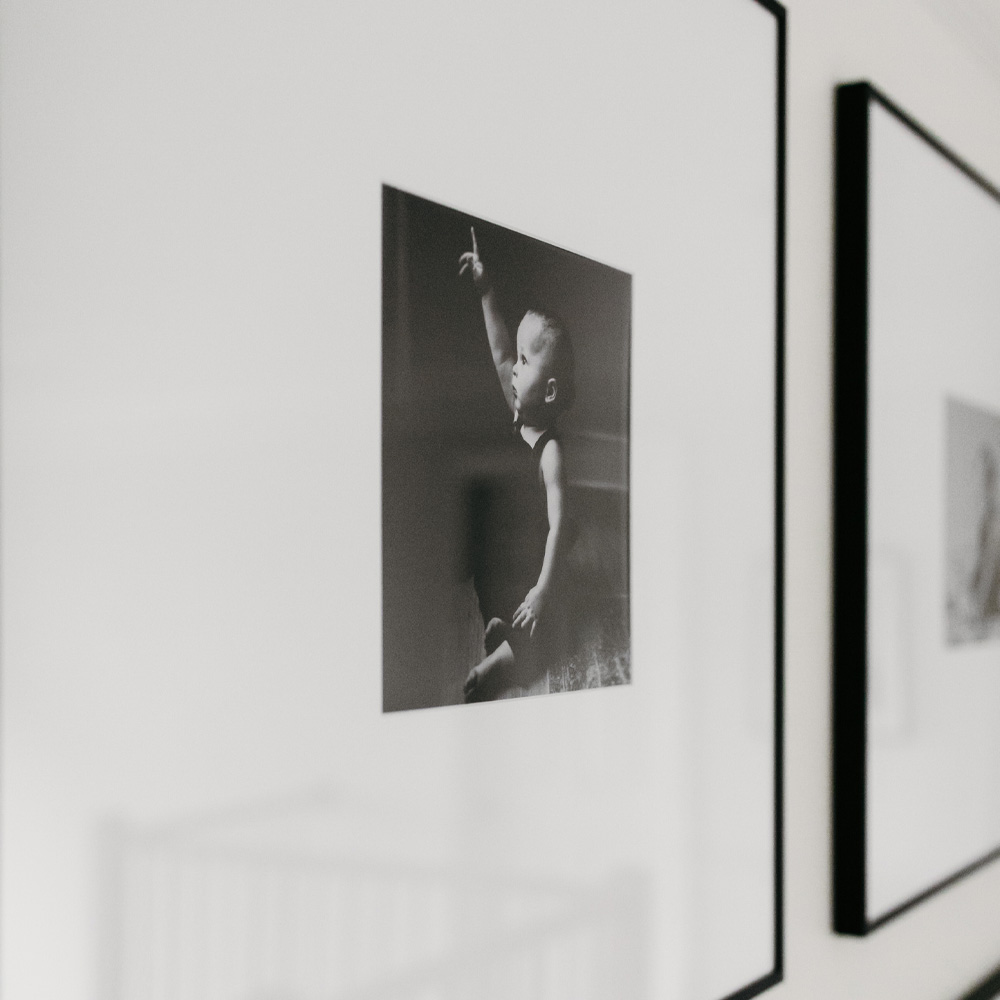 The Perfect Baby Picture Frames: a framed black and white picture of a baby