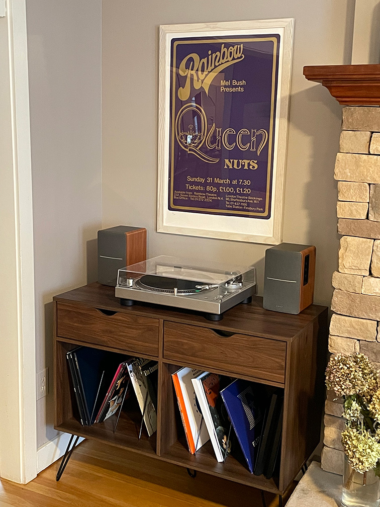 Concert Posters & Band Posters: A music room with a queen poster framed