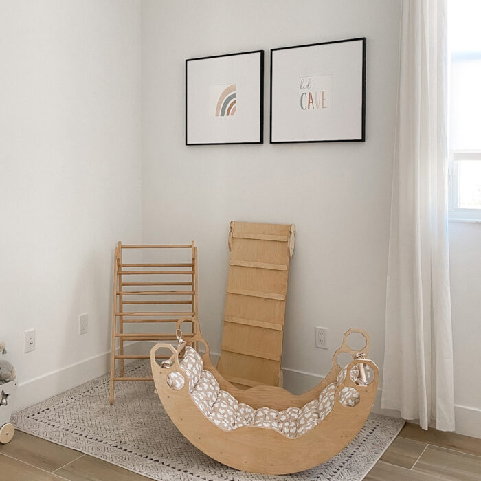 A child's playroom with side-by-side square black frames