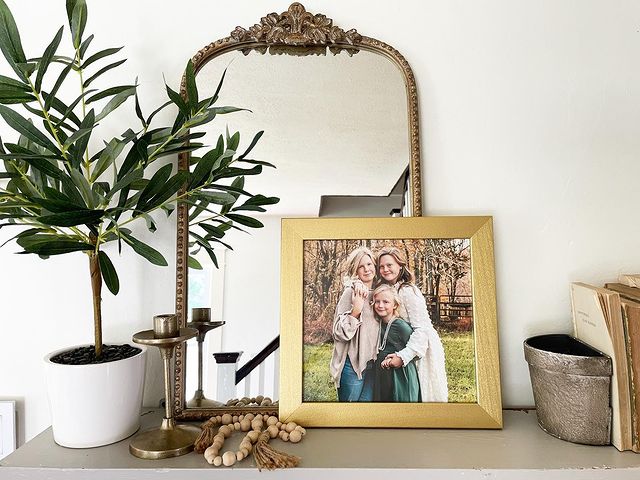 Family Picture Ideas: A family photo on a decorated shelf.