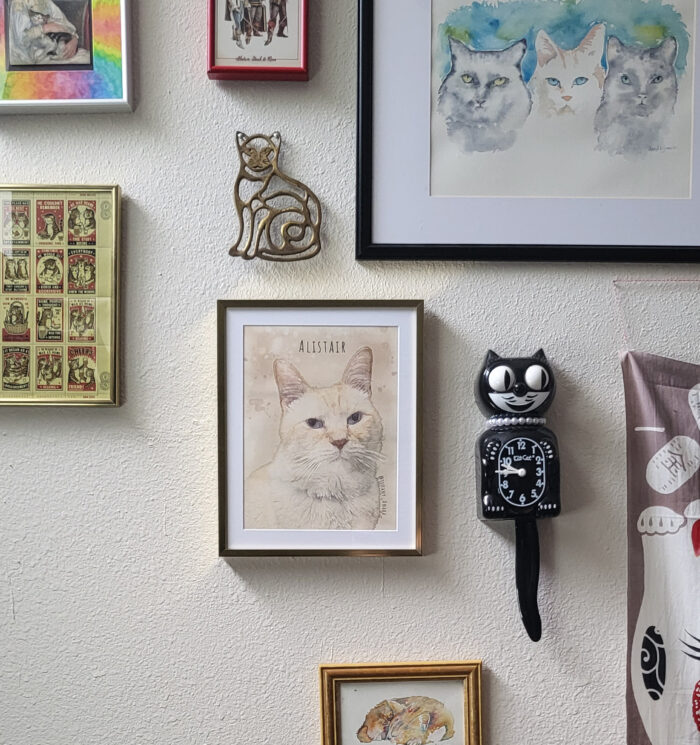 Frames for Artwork: Watercolor artwork hangs in a staggered gallery wall