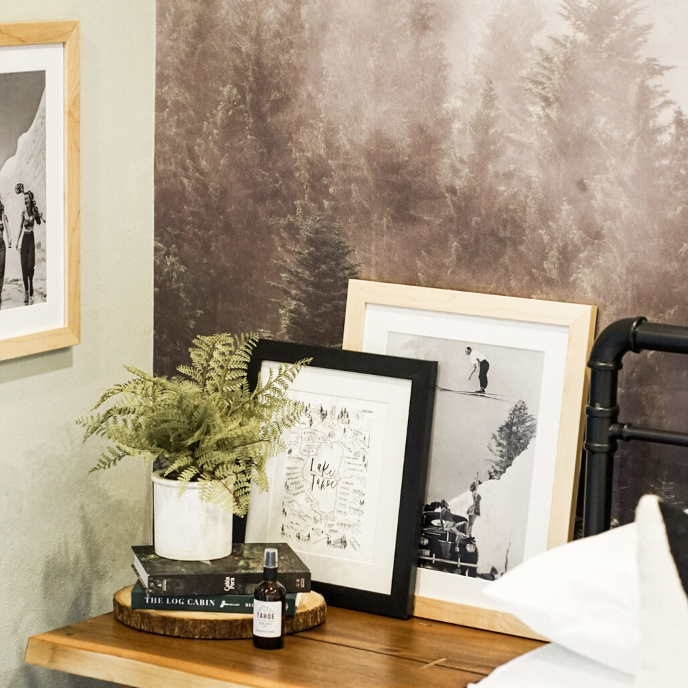 Eco-Friendly Decor Tips:Two framed on a bedside table.