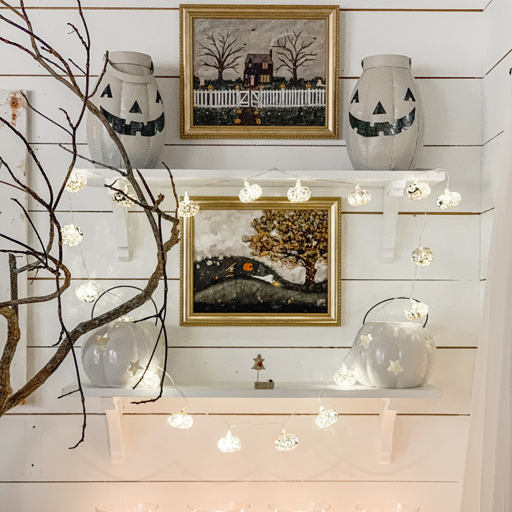 Custom Framing: A halloween shelf display with framed fall art. 