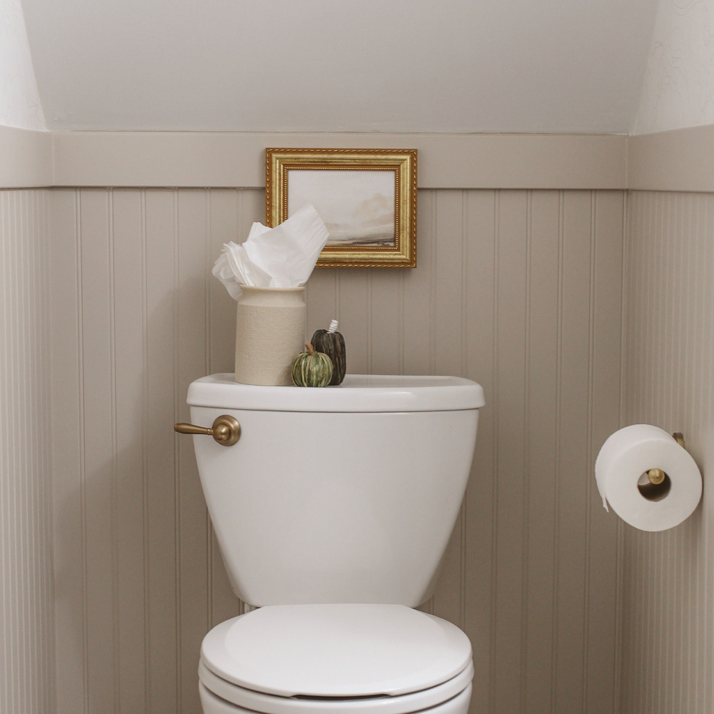 Bathroom Wall Decor Ideas: A small Minimalist bathroom with a singular Granby frame in Gold. 