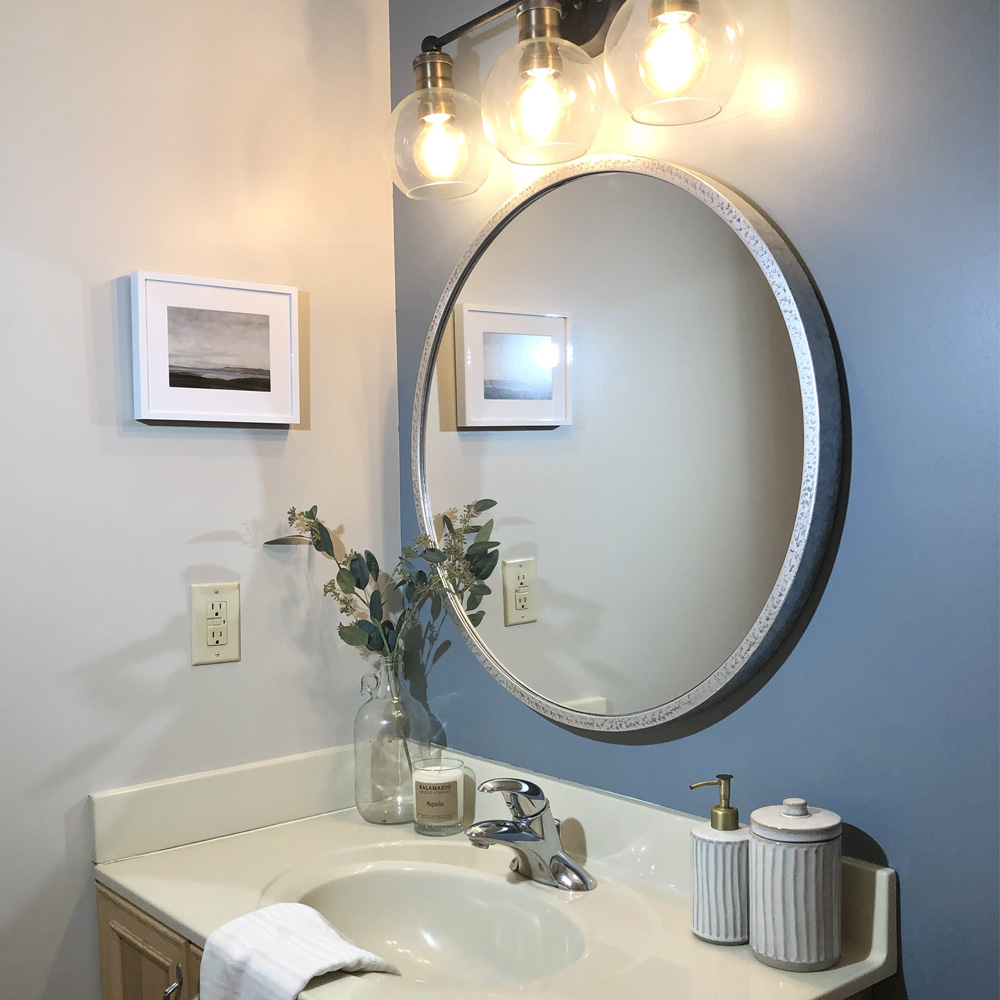 Bathroom Wall Decor Ideas: A small Minimalist style bathroom with clean white decor and frame. 