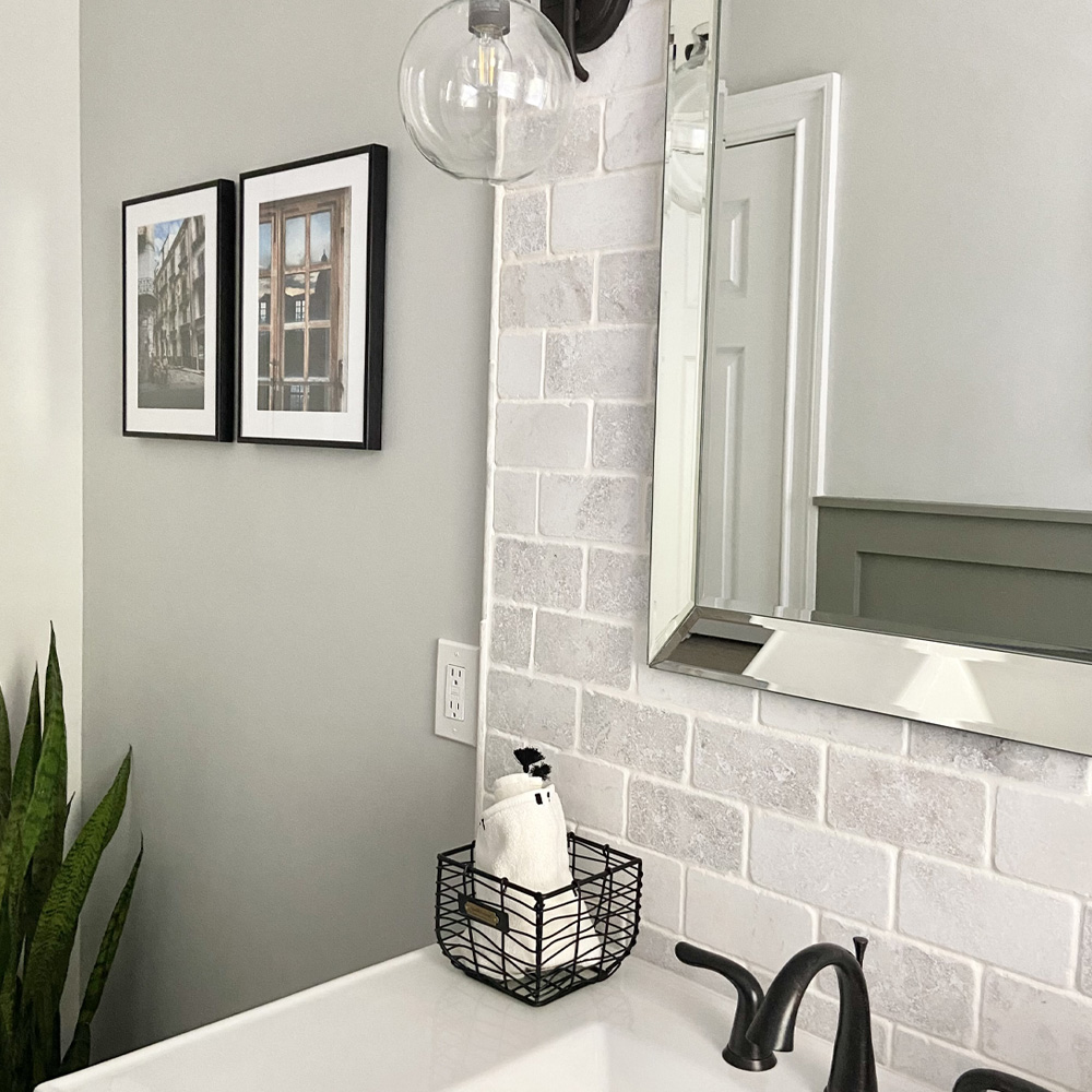 Bathroom Wall Decor Ideas: a Modern style bathroom with a brick backsplash and two Ashford style frames in Satin Black. 
