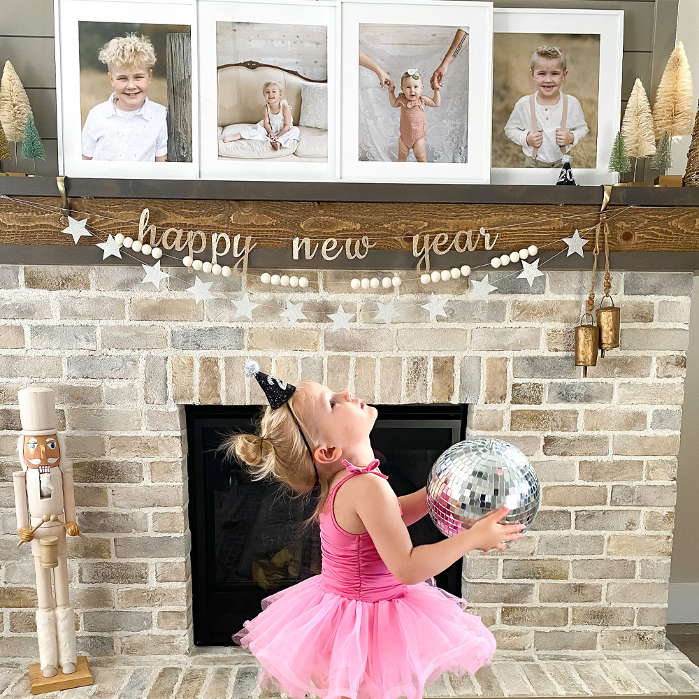 Custom Framing: a mantel display of framed photos of children 