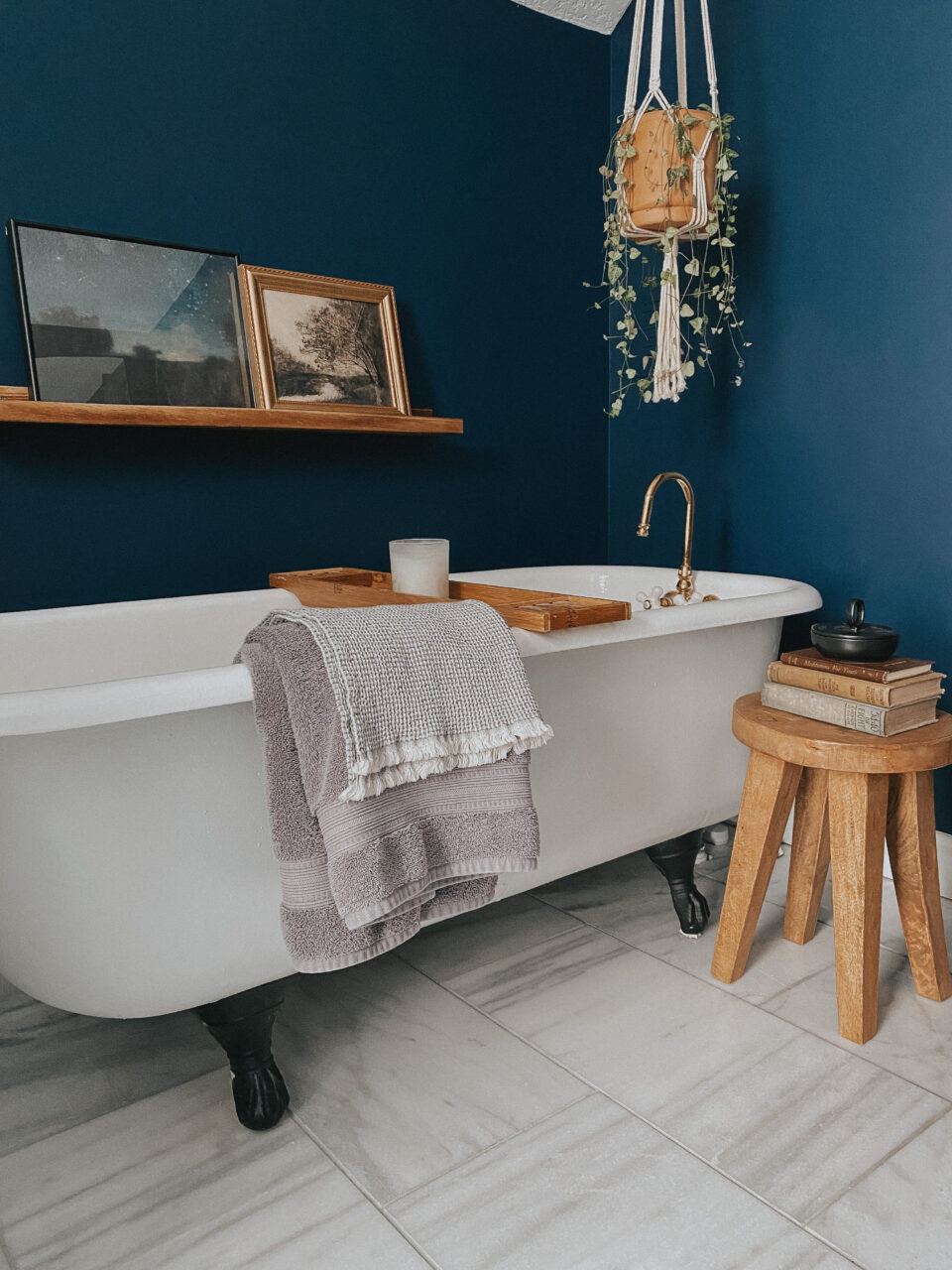 moody bathroom with picture frame on shelf