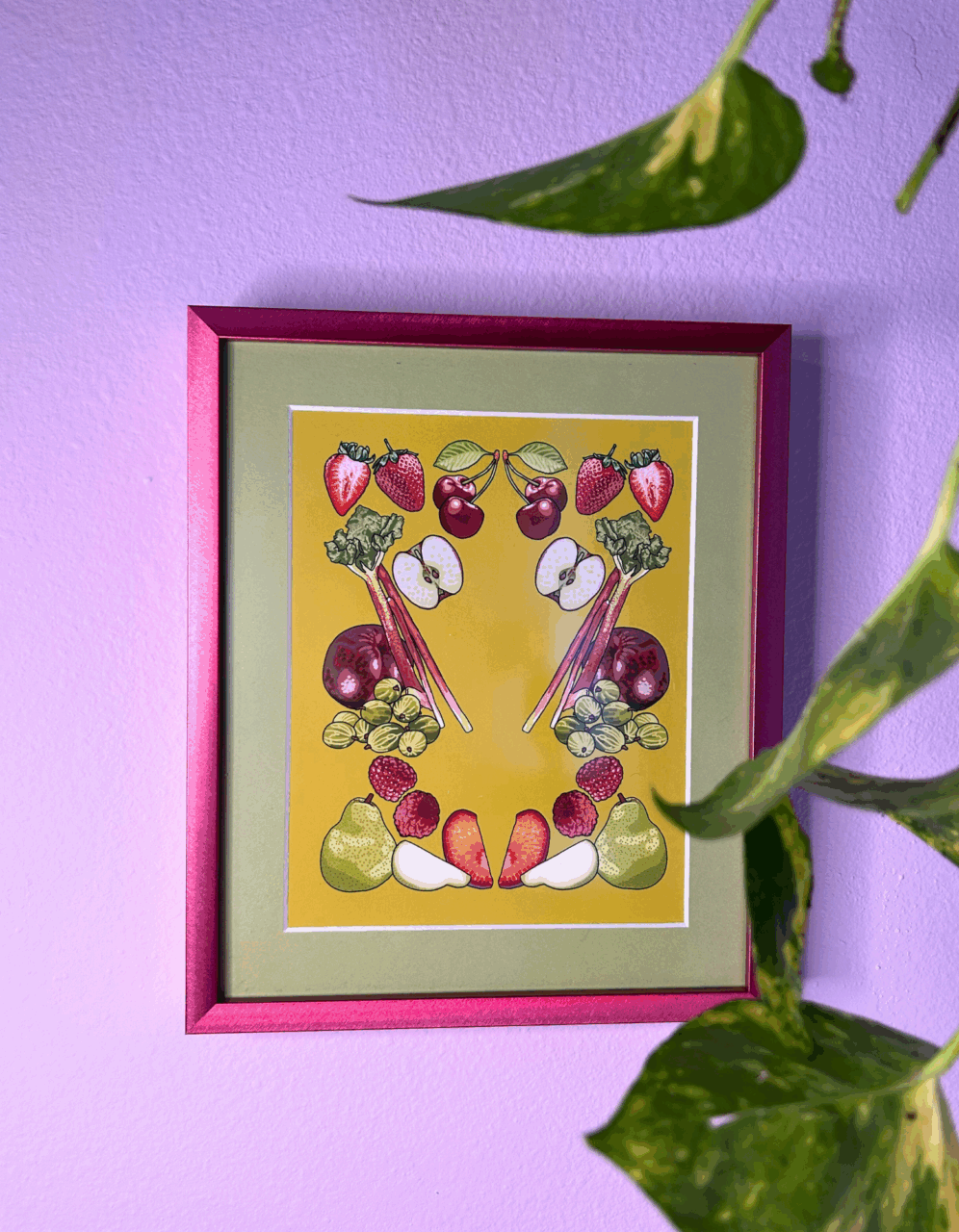 pink picture frame with fruit art print