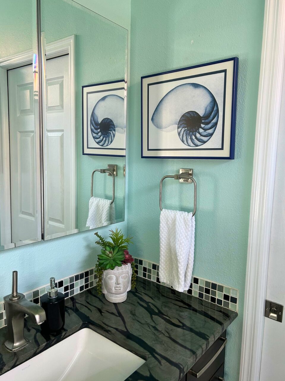 bathroom with framed print