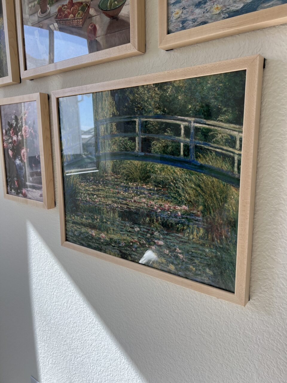 framed Monet in a wood display