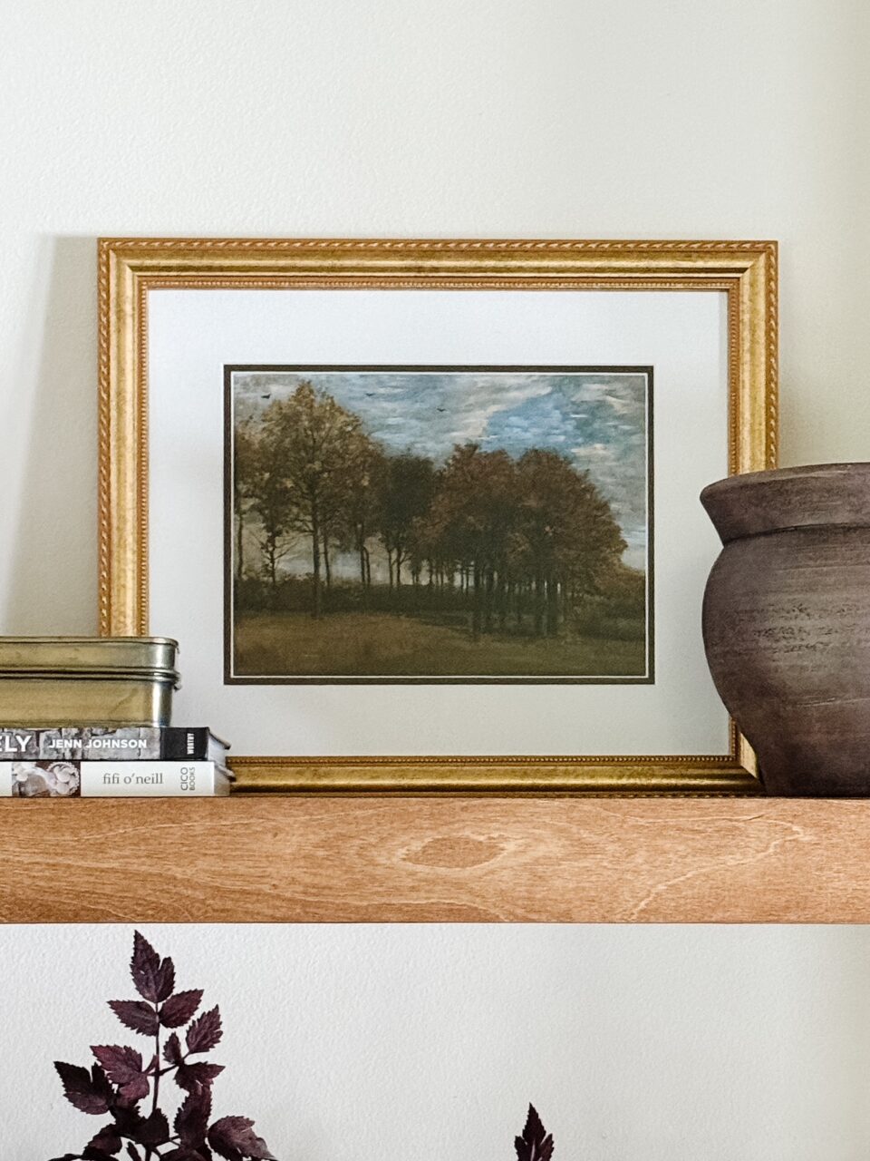 framed art on a shelf