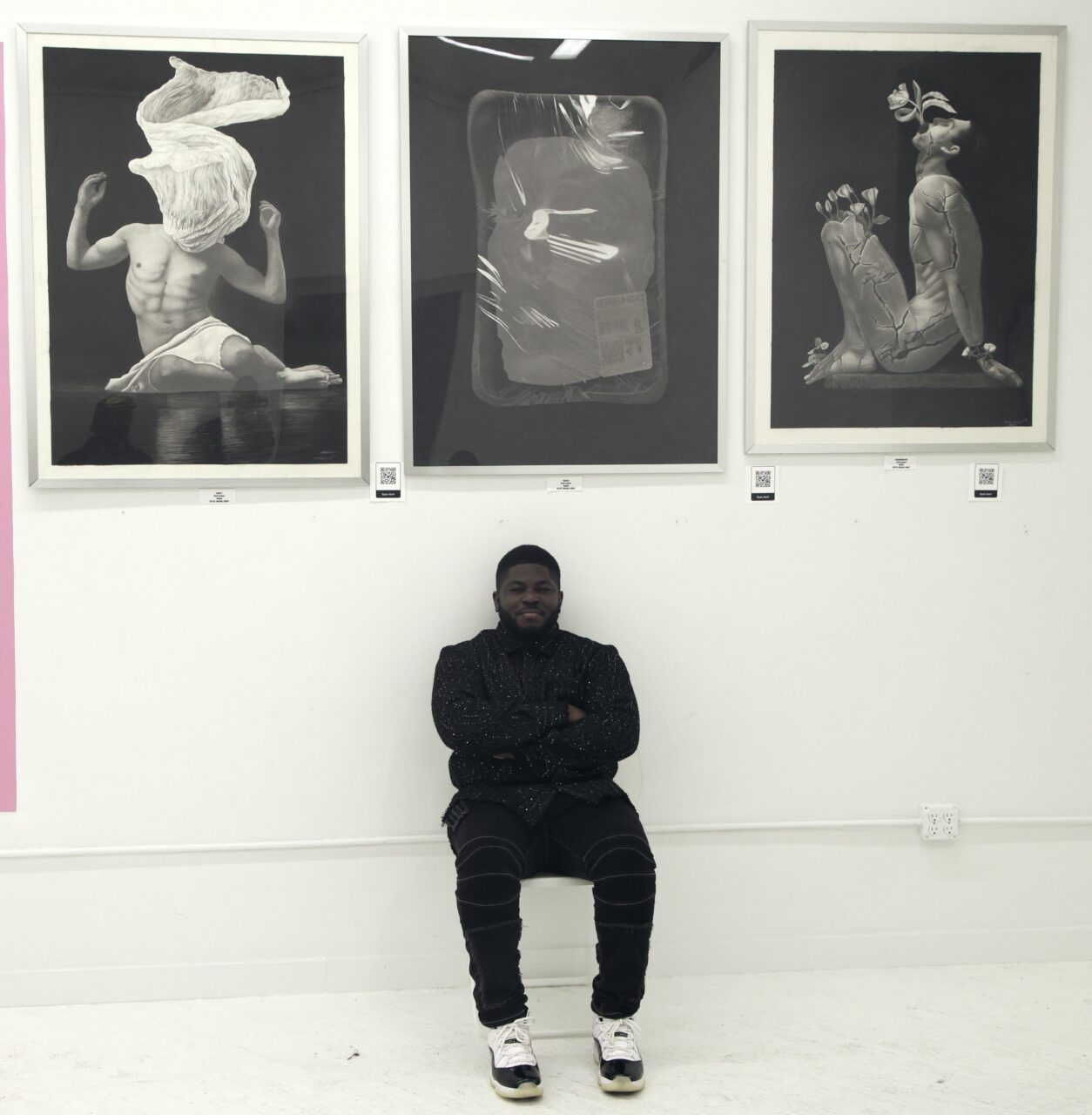 How to Price Art: A Simple Guide for Artists 12 photographer in front of his artwork at a gallery show