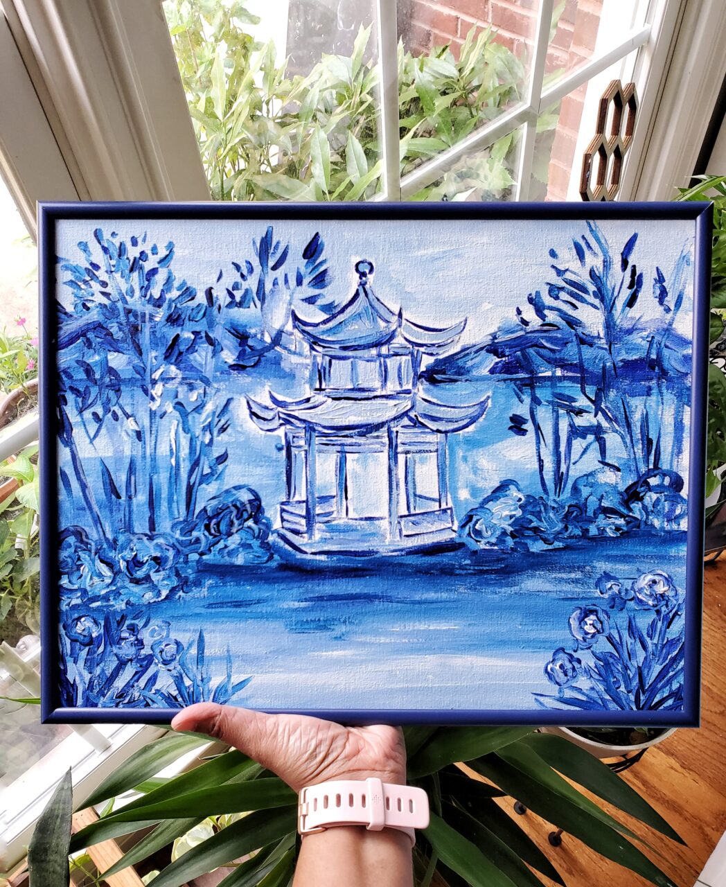 How to Price Art: A Simple Guide for Artists 14 painting of a pagoda in a blue picture frame