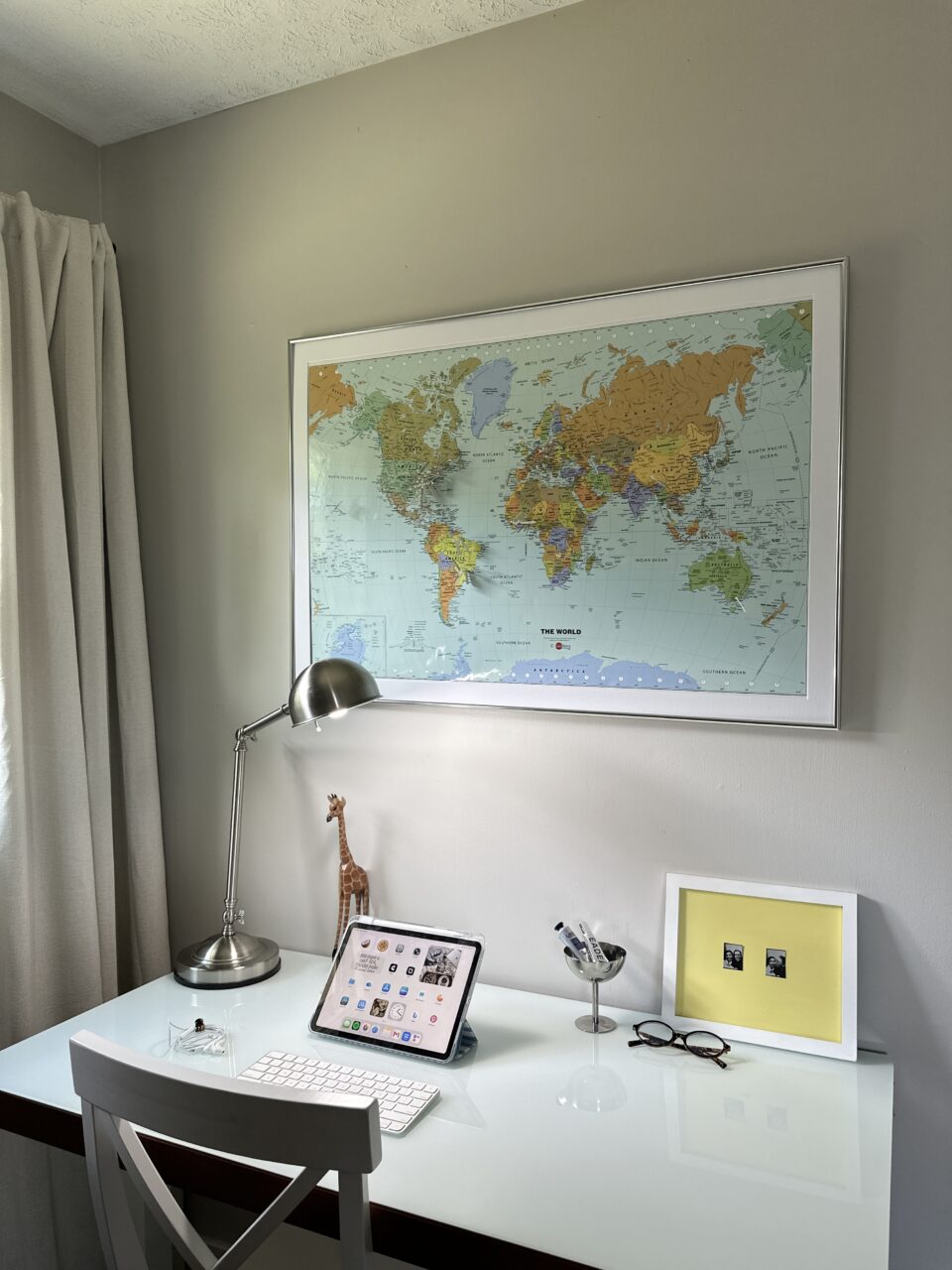 Decorate Your Dorm In Style: 8 Must-Haves for The Best Dorm Decor 1 framed map hanging above a desk
