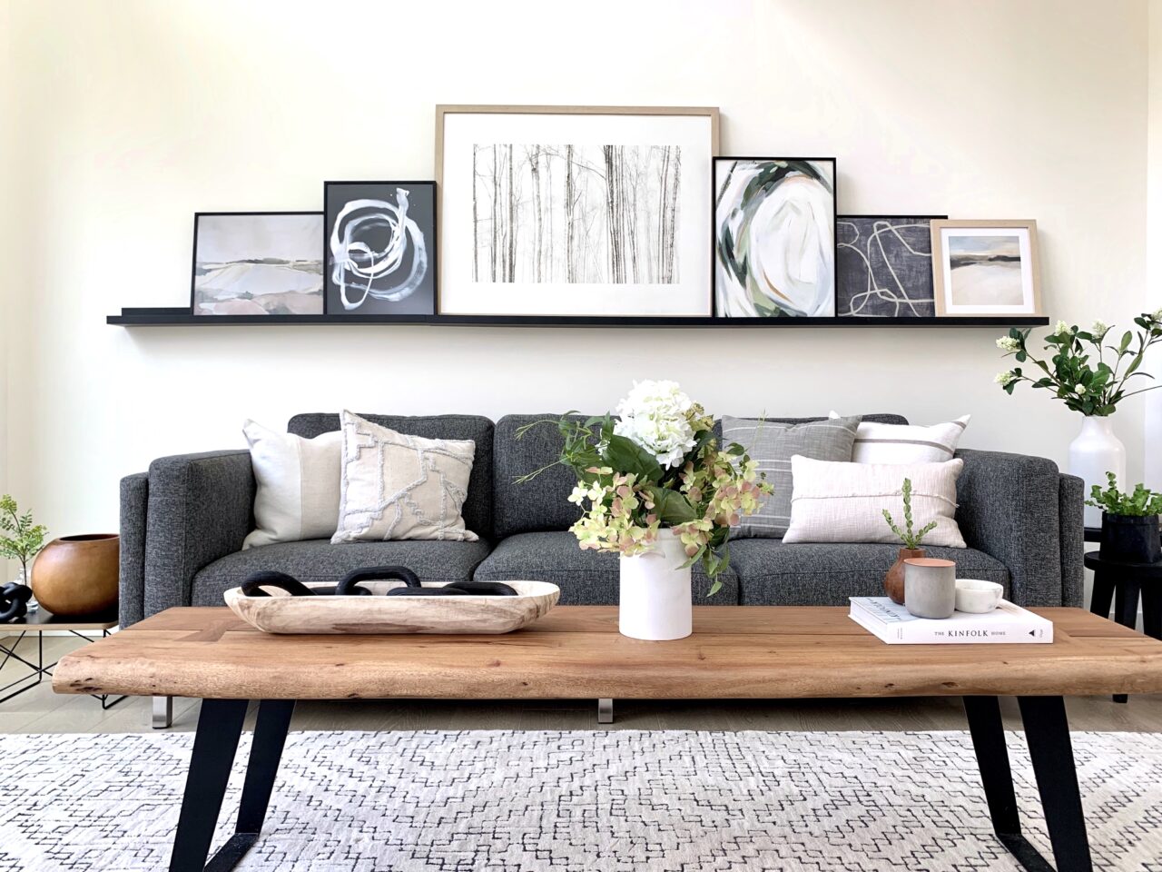 Local Framing vs Online Framing: What's the Real Difference? 9 long shelf with custom frames over a couch