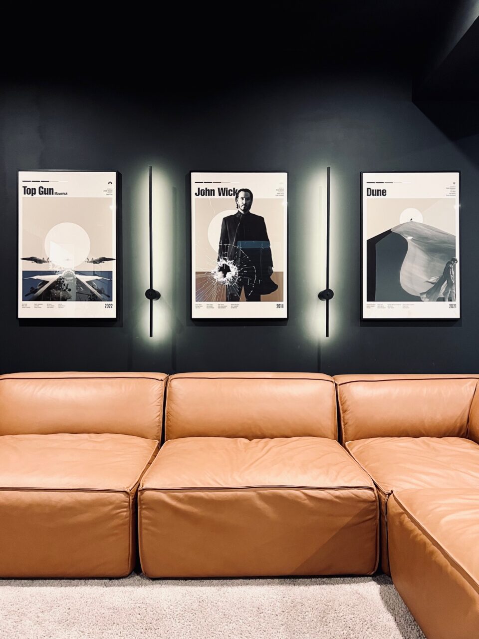 Local Framing vs Online Framing: What's the Real Difference? 6 move posters in a home theater room